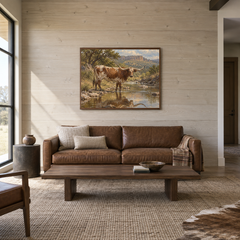 Longhorn at the Creek Western oil painting displayed in a living room