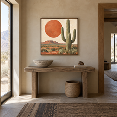 Terracotta Sun & Saguaro oil painting displayed in a adobe-inspired entryway