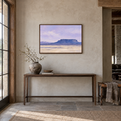 Indigo Mesa oil painting displayed in a adobe-inspired entryway