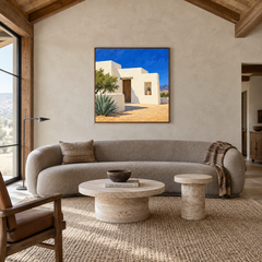 Adobe House in Desert Light oil painting displayed in a modern Southwestern living room