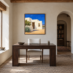Adobe House in Desert Light oil painting displayed in a natural-wood study