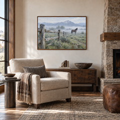 Ranch Fence at Morning painting framed in a stone lodge reading room