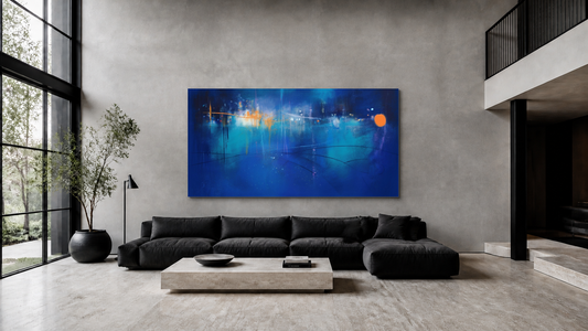 Deep blue and turquoise oversized abstract art above a charcoal sofa in a double-height living room