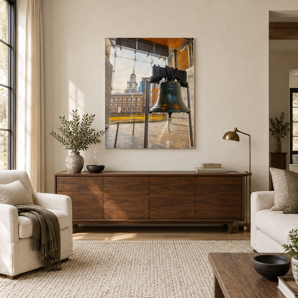 Liberty Bell and Independence Hall oil painting above a walnut console in a sunlit American living room