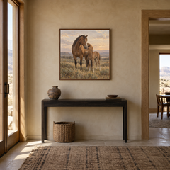 Mare and Morning oil painting of a mare and foal together on the prairie displayed in a Western entryway