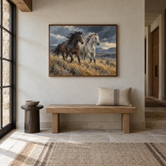 Windbreak oil painting of a dark and a pale horse running through windswept grass displayed in a Western entryway