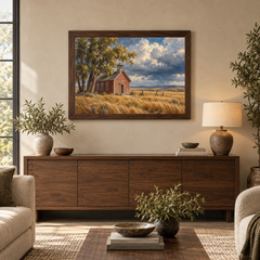 Prairie Schoolhouse Western oil painting displayed in a living room above a walnut credenza
