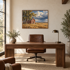 Prairie Schoolhouse Western oil painting displayed in a walnut study above a writing desk