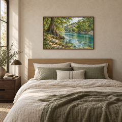 Texas cypress river landscape in a slim frame above a linen bedroom headboard