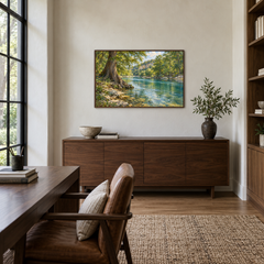 Texas cypress river landscape above a walnut study credenza