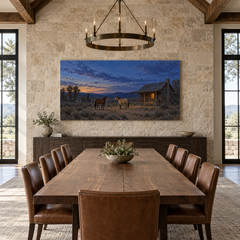 The Station at Blue Hour above a long table in a limestone and leather dining room
