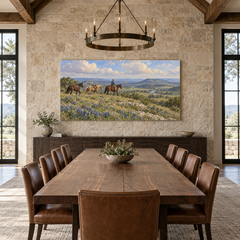 Bluebonnet Ridge above a long table in a limestone and leather dining room