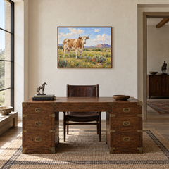Cow in Southwestern Meadow oil painting displayed in a study
