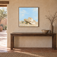 Cowgirl Hat & Wild Daisies oil painting displayed above an entryway console