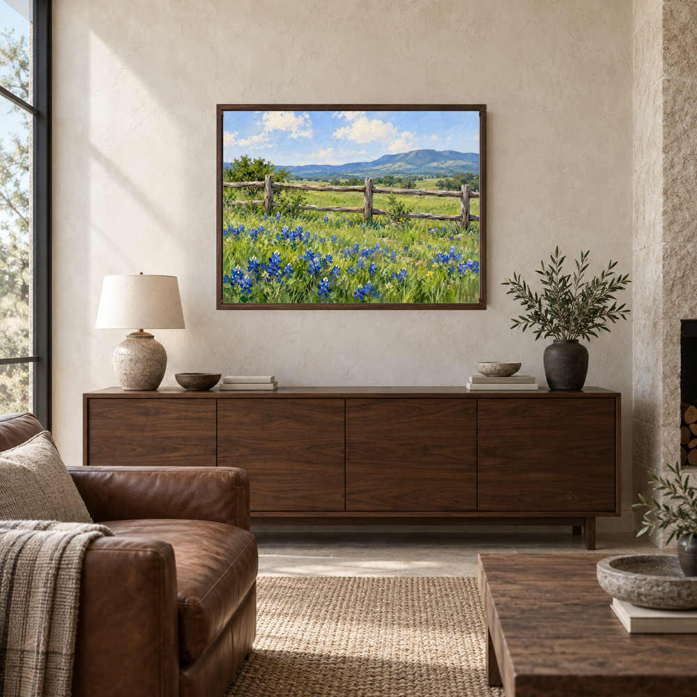 Wildflowers Beyond the Ranch Fence oil painting displayed above a living room sofa