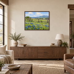 Wildflowers Beyond the Ranch Fence oil painting displayed above a living room sideboard