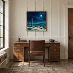 Turquoise Moon Desert oil painting displayed in a natural-wood study