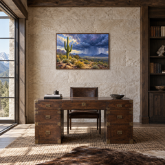 Desert Monsoon oil painting displayed in a natural-wood study