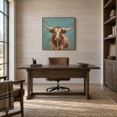 Turquoise Longhorn oil painting displayed in a rustic office
